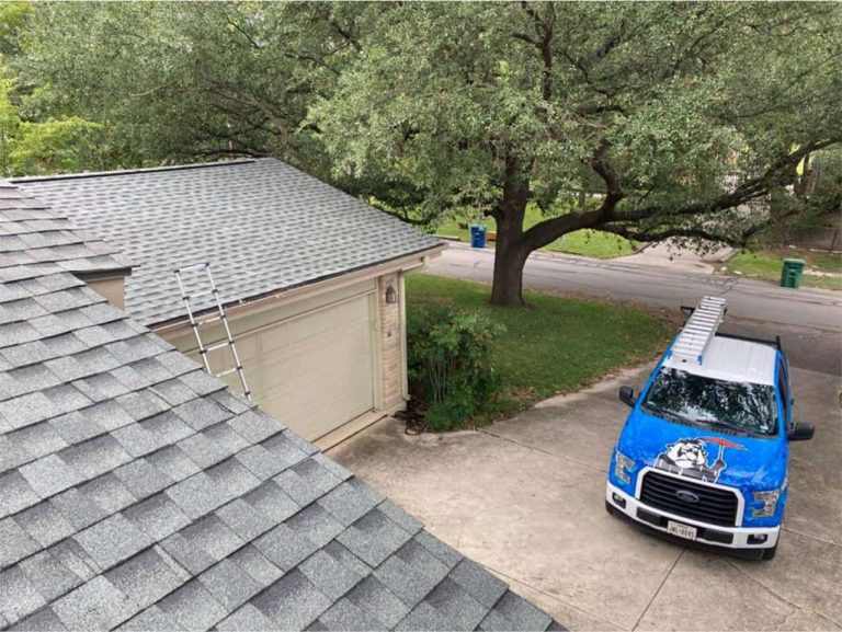 Rolands Roofing Truck Parked outside on a residential roofing job