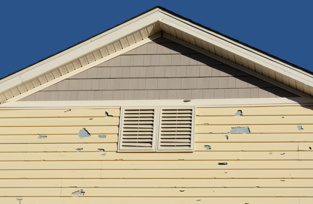 damaged pale yellow siding siding